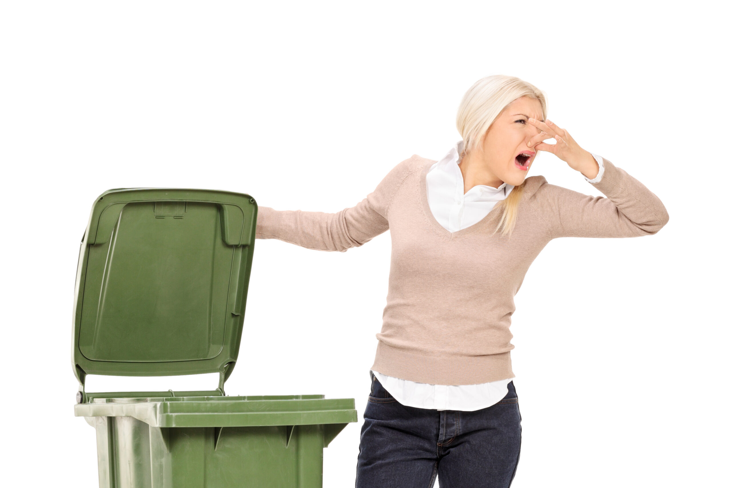 Woman opening a stinky trash can isolated on white background